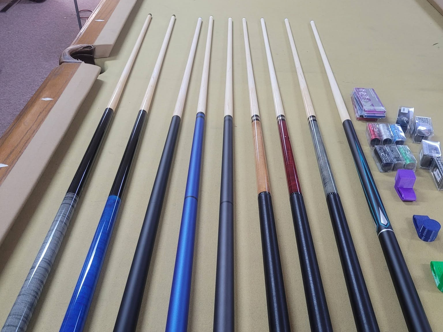 Pool cues and chalk on display